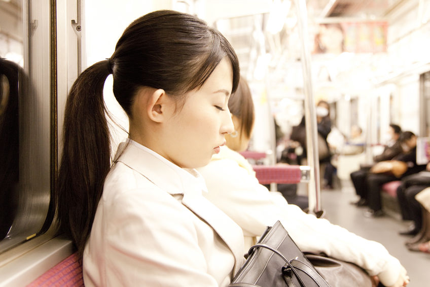 Japanese falling asleep on a train